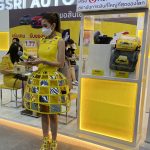 Woman in yellow dress at the Thailand International Motor Expo