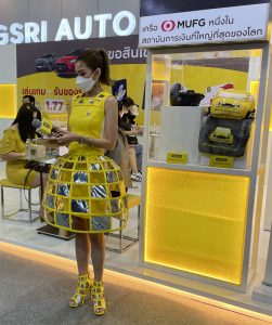 Woman in yellow dress at the Thailand International Motor Expo