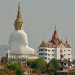 Wat Phra That Sorn Kaew statue from behind long distance